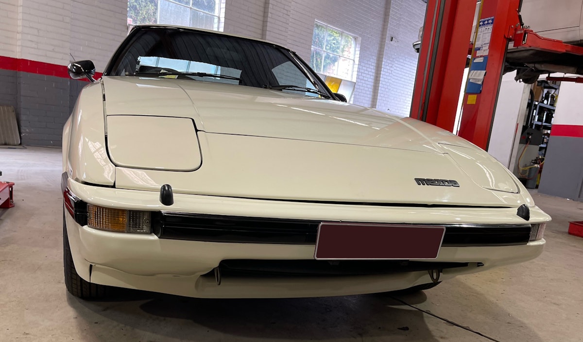 This white 1980's Mazda RX-7 features a rotary engine and strikes the right balance of sportiness and reliability plus it's low price tag made it a popular vehicle to purchase.